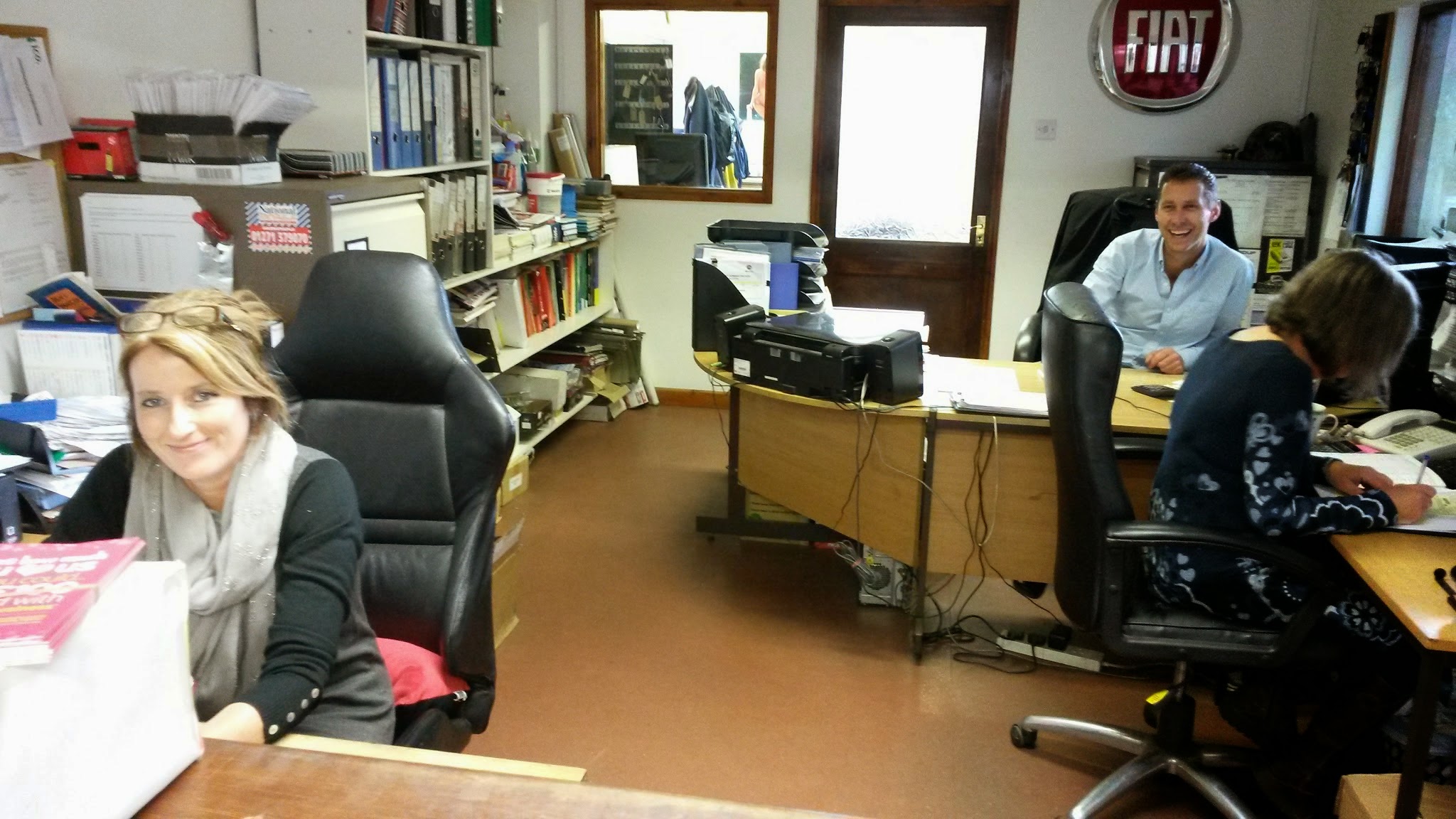 Reception and office at W Sanders & Sons, with the Fiat sign on the wall
